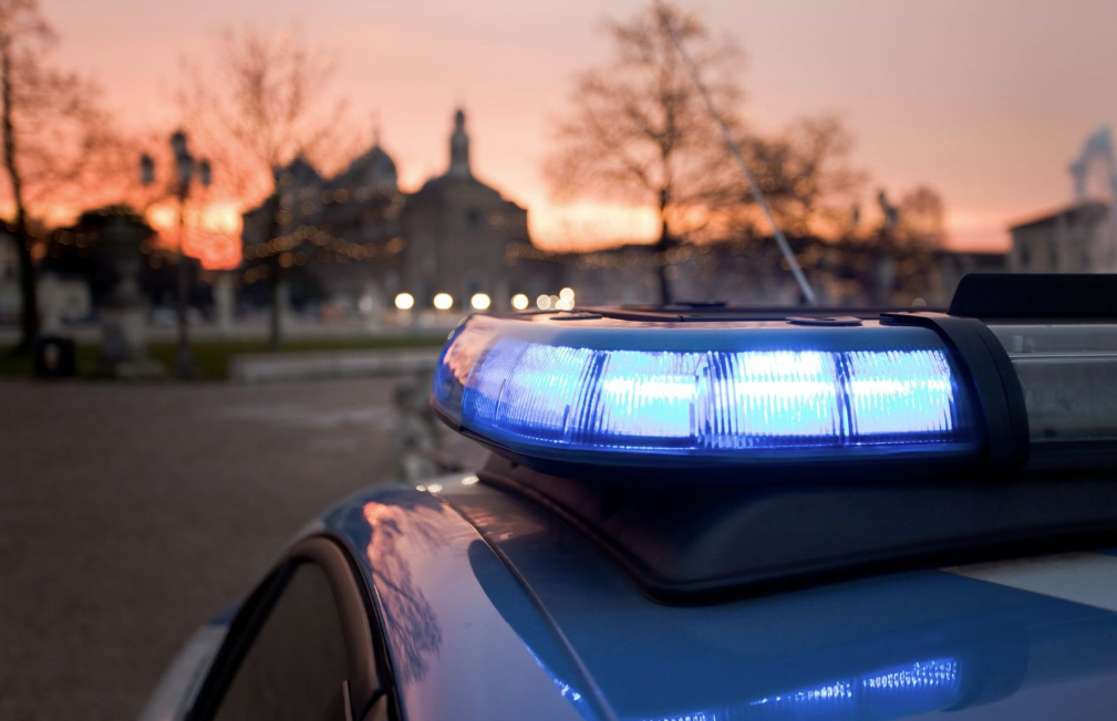 Cop car lights with church in the background