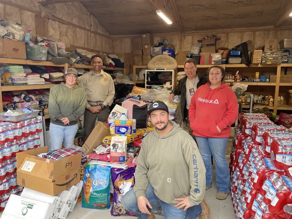 Photo of people organizing the pet food donations 