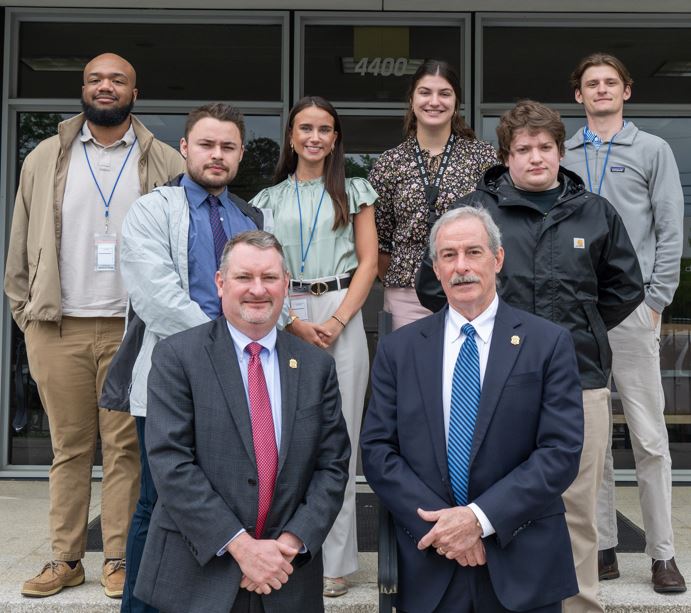 Spring Interns standing with SLED's Chief and Assistant Chief