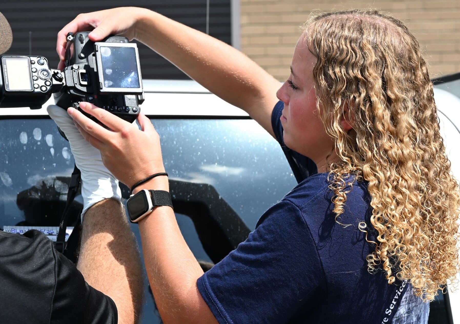 SLED intern takes photo at mock crime scene exercise.
